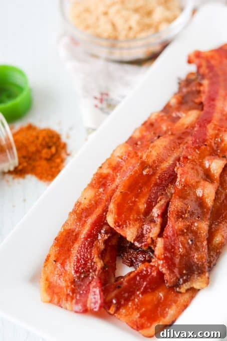 A generous serving of Cajun Candied Bacon neatly arranged in a rustic basket, ready to be enjoyed.