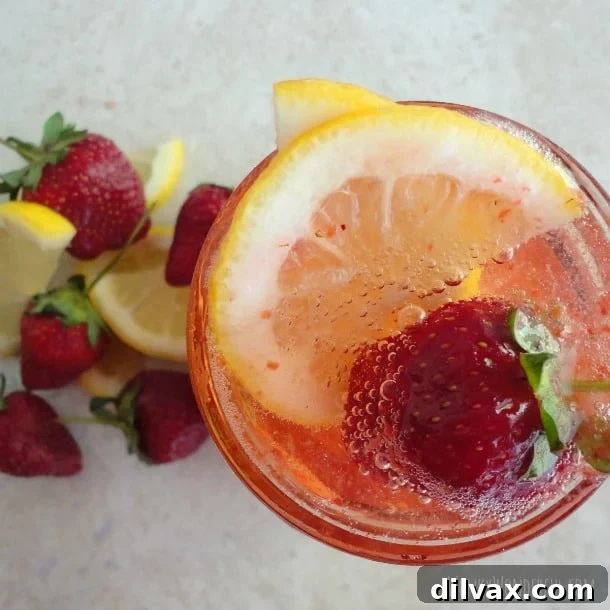 Lemonade Libations: 40+ Ways to Refresh This Summer 19 Bubbly Strawberry Lemonade Fizz, a delightful and refreshing sparkling drink.