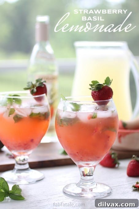 Strawberry Basil Lemonade (Spiked), a red cocktail with fresh strawberries, basil leaves, and lemon.