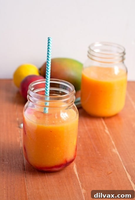 Lemonade Libations: 40+ Ways to Refresh This Summer 7 Exotic Peach Mango Lemonade, blending sweet peaches and tropical mango with zesty lemon.