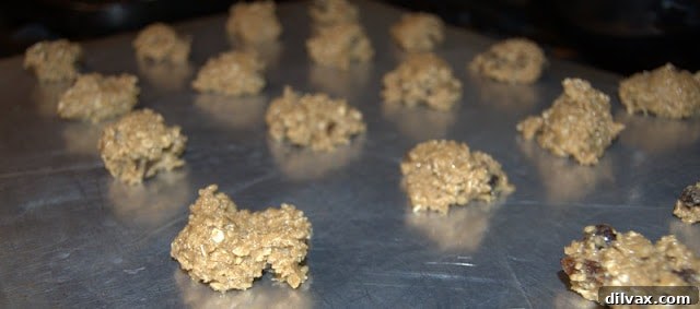 Cookie dough drops arranged on a baking sheet