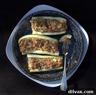 Savory Stuffed Zucchini 5 Deliciously baked stuffed zucchini halves in a baking dish, ready to serve.