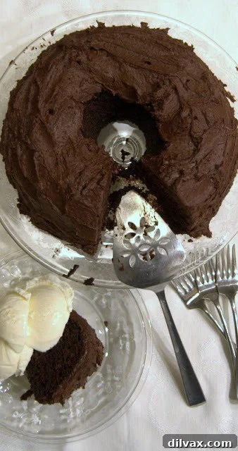 A slice of root beer float cake with a side of vanilla ice cream, resembling a classic root beer float.