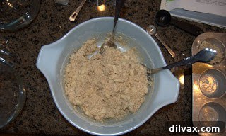 Wholesome Apple Oatmeal Muffins 2 Preparing Apple Oatmeal Muffin batter in a mixing bowl with a spatula