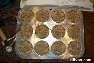 Wholesome Apple Oatmeal Muffins 3 Apple Oatmeal Muffins with crumb topping arranged in a muffin pan, ready for baking