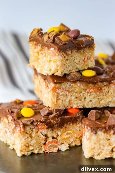 Reese's Peanut Butter Krispie Crunch 3 Top view of Reese's Peanut Butter Rice Krispies Treats, showcasing the vibrant Reese's mini pieces.