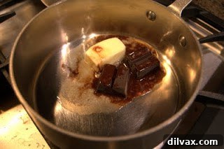 Grown-Up Brownies 2 Melting unsweetened chocolate and butter in a saucepan over low heat for brownie batter.