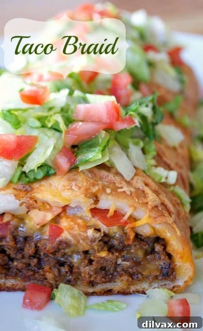 Twisted Taco Bake 3 Close-up of a Taco Braid slice, revealing the seasoned ground beef, melted cheese, and fresh tomatoes inside the golden braided pizza dough.