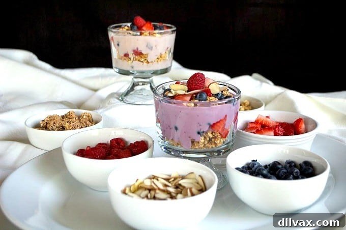 A vibrant Breakfast Parfait Bar featuring Silk Dairy-Free Yogurt, Simple Truth granola, and an assortment of fresh fruits, ready for assembly.