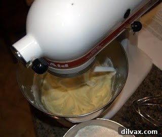 Jam or Marmalade Bars: A Delicious Dilemma 3 Adding and blending an egg into the creamed shortening mixture.