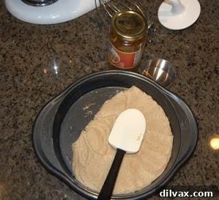 Jam or Marmalade Bars: A Delicious Dilemma 5 Spreading half the dough into the bottom of the baking pan.