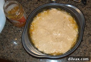 Jam or Marmalade Bars: A Delicious Dilemma 7 Patting the remaining dough on top of the marmalade layer.