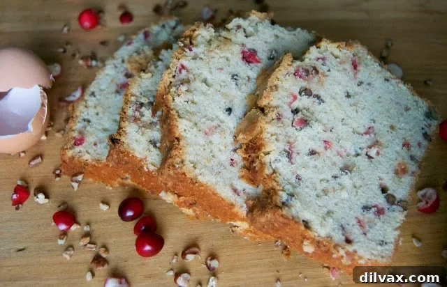 A festive Pumpkin Spice Cranberry Pecan Pound Cake, beautifully decorated for fall.