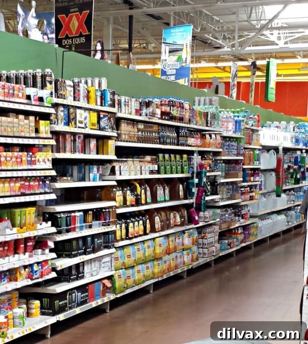 Ingredients for Lady LiberTEA Raspberry Punch, including Snapple Lady LiberTEA, fresh raspberries, blueberries, and a pitcher.