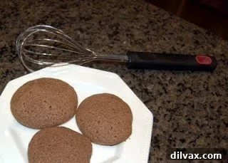 Velvet Nutella Sour Cream Cookies 4 Baked Nutella sour cream cookies cooling on a wire rack.