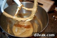 Combining molasses, shortening, brown sugar, and egg in a bowl