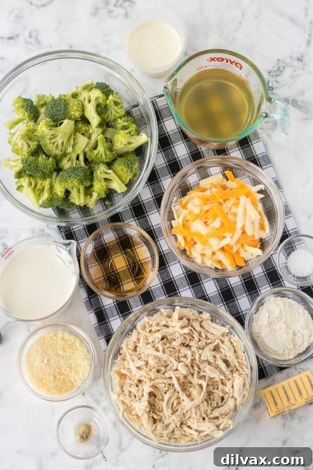 Hearty Chicken Broccoli Casserole 4 Fresh ingredients laid out for making Chicken Divan, including broccoli, chicken, cheese, and butter.