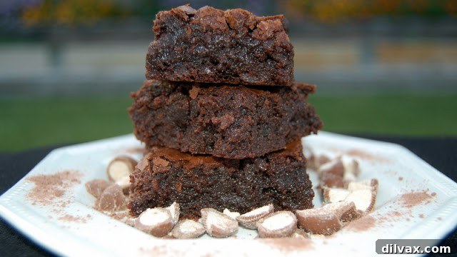 Freshly baked Malted Brownies cooling on a wire rack.