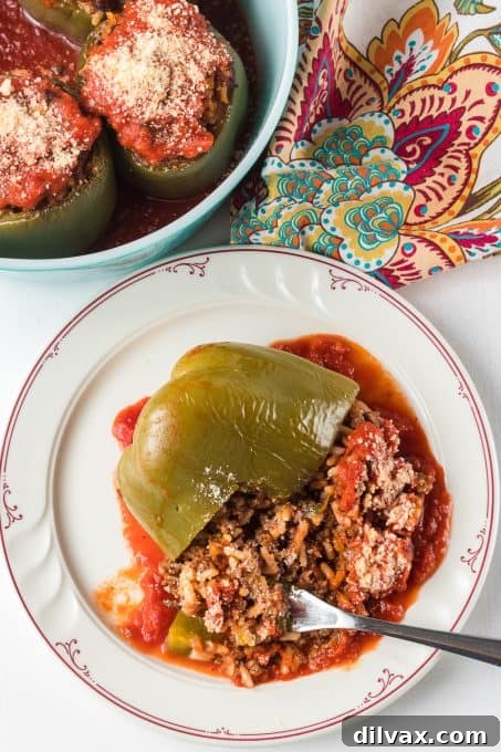 A stuffed pepper in tomato sauce.