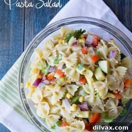 Close-up shot of the Tex-Mex Pasta Salad with a focus on fresh ingredients.