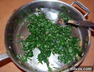 Wilted spinach, ready to be incorporated into the quiche filling.