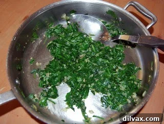 Savory Spinach, Bacon and Gruyere Quiche 5 Wilted spinach in a skillet