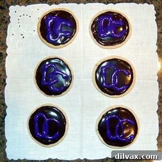 Close-up of frosted cookies with initials