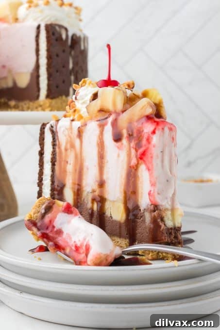 A delightful bite taken from a slice of frozen banana split cake.