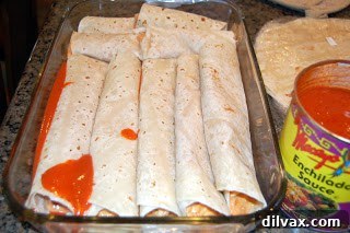 Another baking dish filled with rolled enchiladas