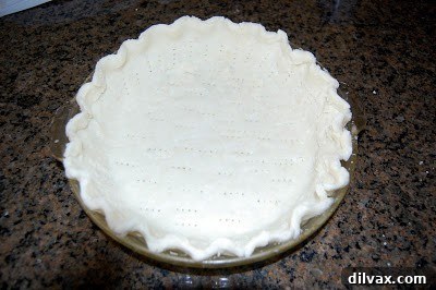 Pie crust pressed into a pie pan, ready for baking