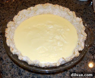 First layer of creamy filling spread in the pie crust
