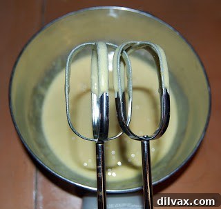 Unlocking the Authentic Sponge Cake 2 Beating egg yolks and lemon juice until pale and thick, creating a fluffy base.