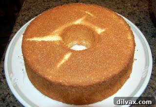 Unlocking the Authentic Sponge Cake 6 Freshly baked sponge cake in a tube pan, golden brown and perfectly risen.