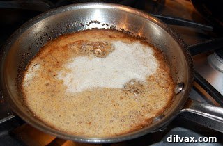 Melting and browning butter in a saucepan for a nutty flavor base.