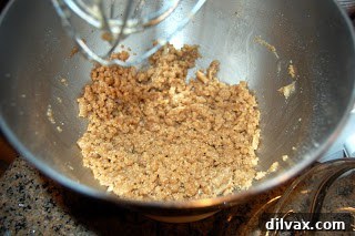 Mixing brown butter, egg, and vanilla into flour and sugar to form the bar dough.
