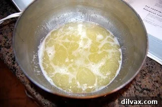 Day 79: Lemon Meringue Pie 5 Egg whites and sugar in a bowl over hot water