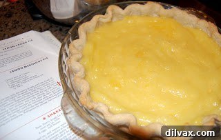 Pillowy Lemon Meringue Perfection 4 Lemon filling spread in baked pie crust