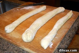 Challah dough after rising, significantly increased in volume and looking light and airy.