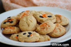 Soft pumpkin spice cream cheese cookies on a platter