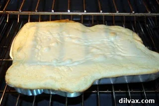 Cake batter poured into a shaped pan
