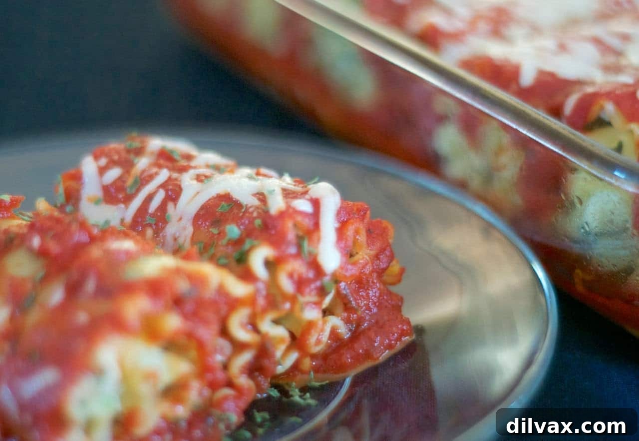 Savory Spinach Ricotta Lasagna Rolls 2 Delicious Spinach Lasagna Roll-Ups arranged neatly in a baking dish