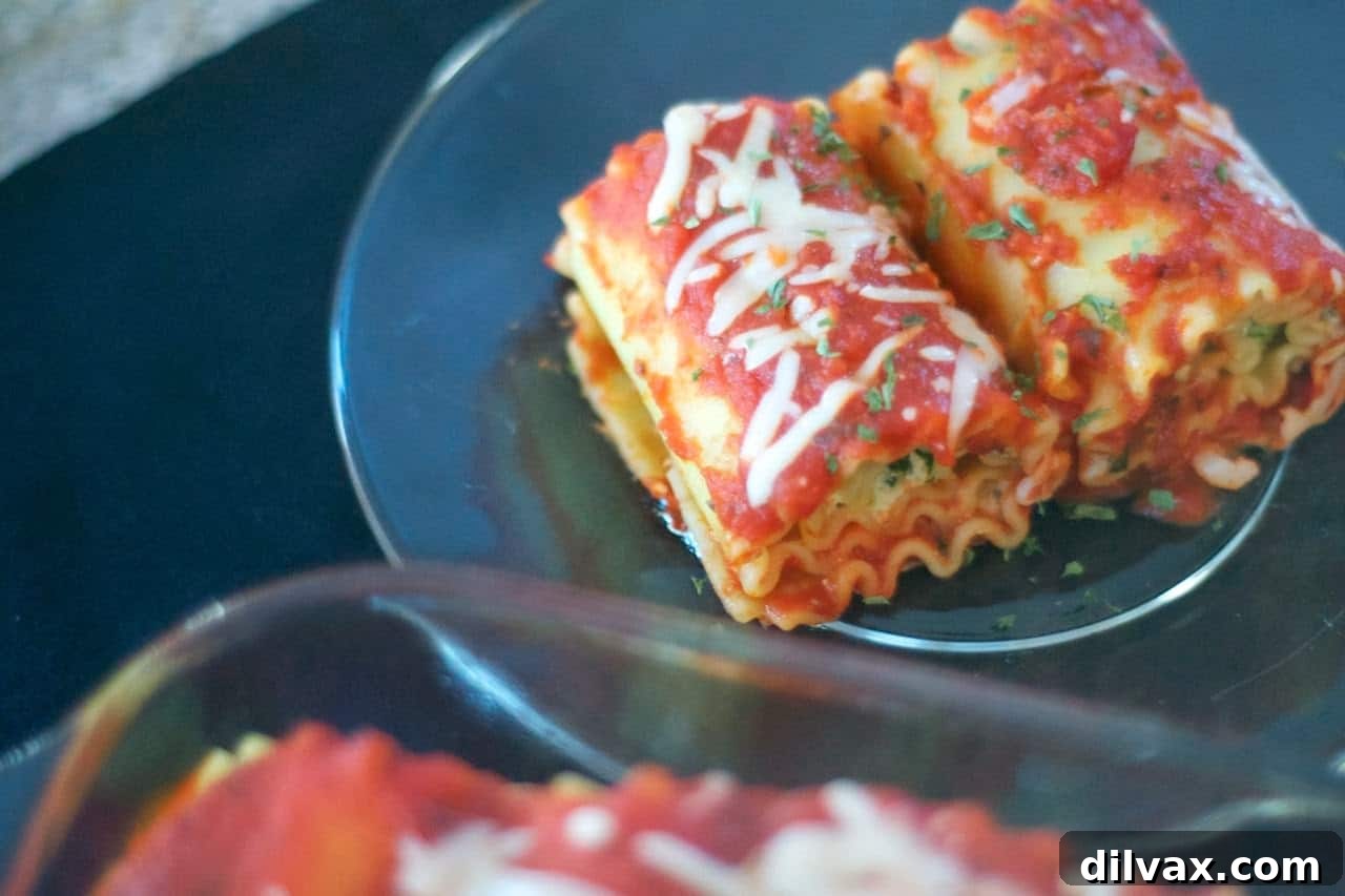 Savory Spinach Ricotta Lasagna Rolls 8 Plated Spinach Lasagna Roll-Ups, garnished and ready to be served