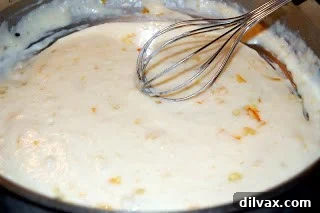 Cooking the base sauce with butter, flour, milk, and orange marmalade until thickened.
