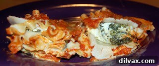 Baked lasagna rolls fresh out of the oven, with melted cheese and sauce