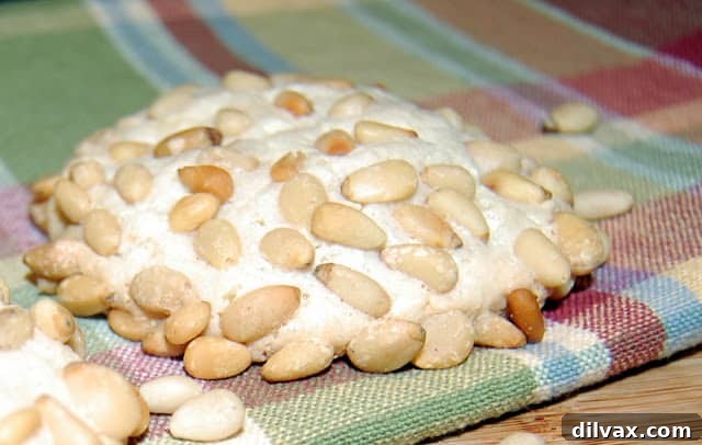 Sweet Pignoli Perfection 6 Baked Pignoli cookies cooling on a wire rack.