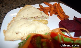 Savory Gluten-Free Ham and Cheese Pockets 6 Baked gluten-free ham and cheese pocket pies, golden brown and ready to serve.