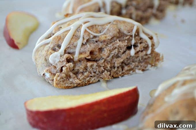 Maple-Glazed Apple Cinnamon Scones 2 Warm apple cinnamon scones with a sweet maple glaze, perfect for breakfast or tea.