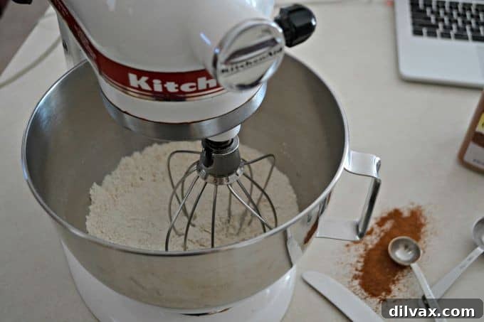 Maple-Glazed Apple Cinnamon Scones 4 A close-up of a scone, showing the apple pieces and maple glaze.