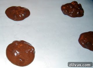 Cookie dough dropped onto a greased baking sheet.