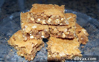 Close-up of cut butterscotch brownies, showing their moist, chewy texture, ready to be served.
